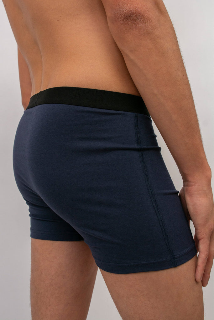 Akin Essentials Sustainable and eco-friendly men's underwear and briefs made of 100% organic cotton available in UK in Black, blue and tack along with a monthly subscription. Comes with eco-friendly compostable and recyclable packaging, plastic free 